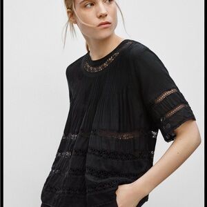 Gauzy summer top with lace details.  Good condition.